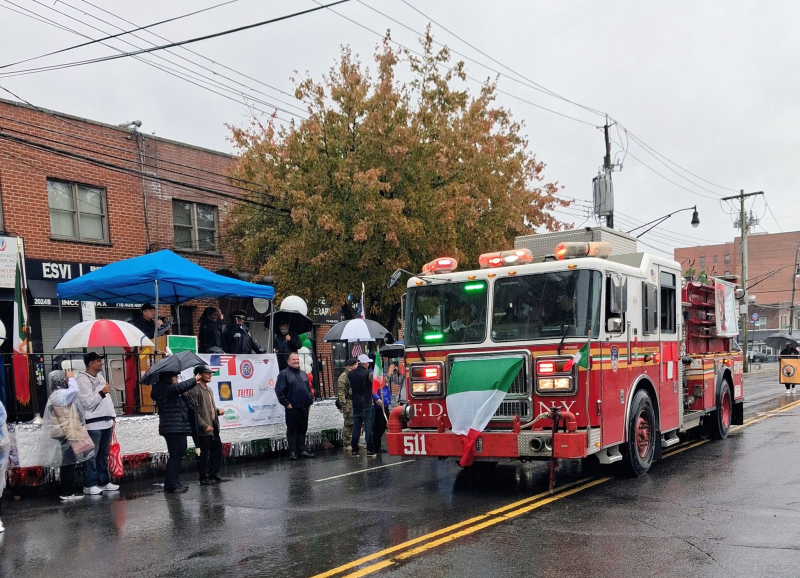 Rain fails to dampen spirit at Morris Park Columbus Day Parade